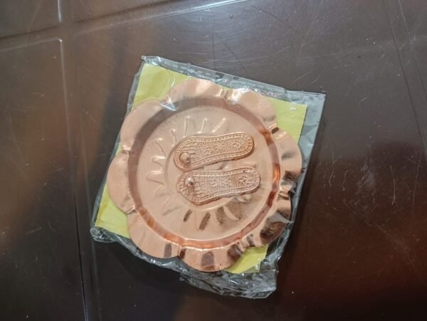 "Maa Lakshmi Charan Copper/Brass (Gold) with Plate for wealth and prosperity." "Sacred Lakshmi Charan for Puja with copper and brass (gold) plate." "Lakshmi Charan Copper Brass Plate for attracting good fortune in Puja."