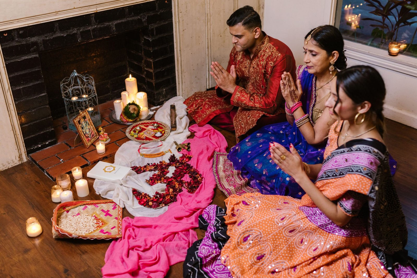 A family gathering for a prayer ceremony, showcasing Indian culture and traditions.